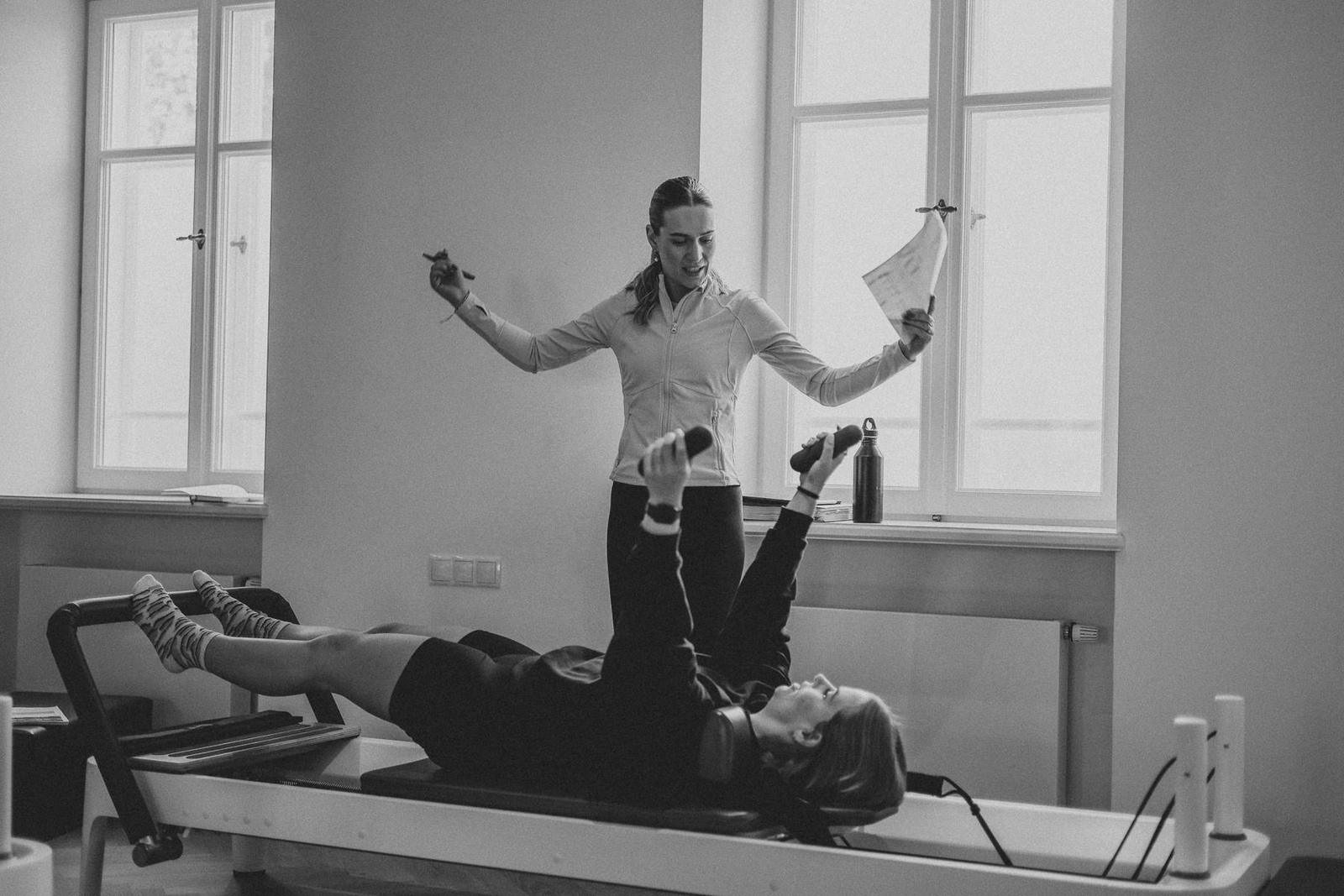 Students and trainer working on Reformers during a Body Form Education intake